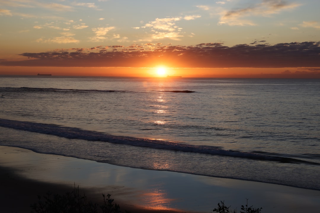 Beach Sunrise All Over Print Hoodie Perfect for Travel and Outdoor Adventures